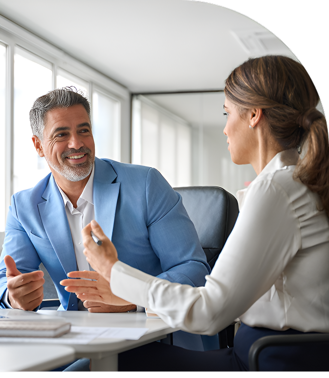 Two professionals engaged in a friendly business conversation.