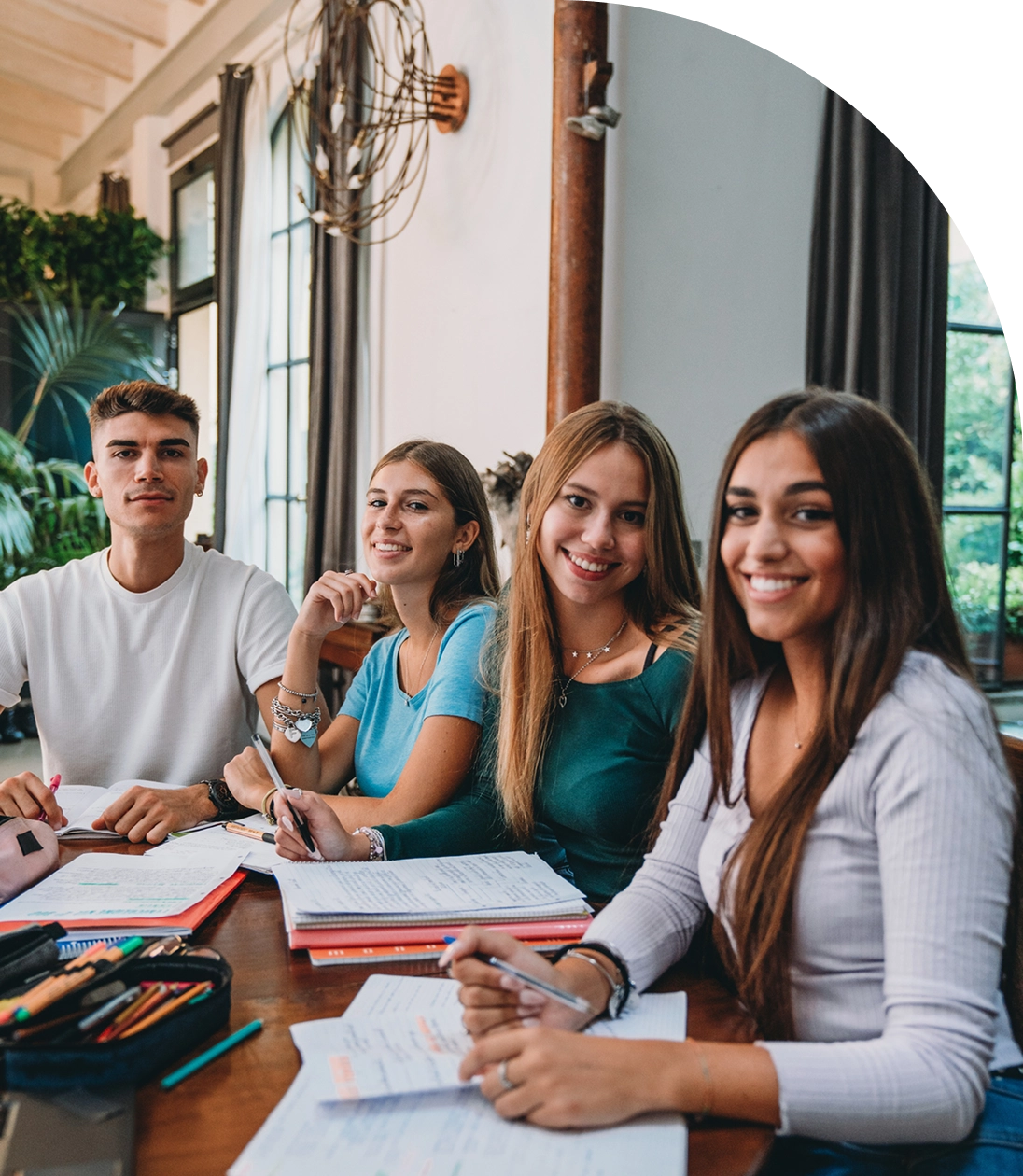 Young people smiling while studying