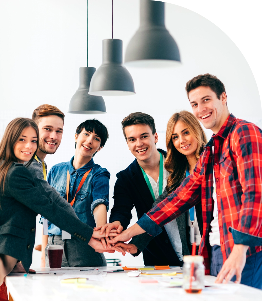 Team celebrating success with hands in center